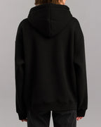 Rückansicht des schwarzen Hoodies mit schlichter Rückseite und aufgesetzter Kapuze.